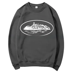 Detail of dark grey crewneck sweatshirt with white graphic print and size M neck label