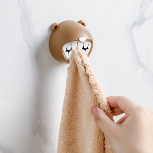 Brown bear-shaped towel holder hook for bathroom walls with minimalist no-drill design