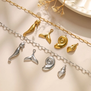 18K gold and silver ocean charms with seahorse and fish tail on rectangle link chains