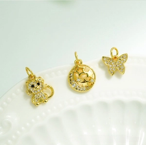 Detailed 18K gold plated charms featuring crystal cat, moon, and butterfly shapes