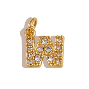 Detailed close-up of golden letter W pendant with white cubic zirconia pavé setting