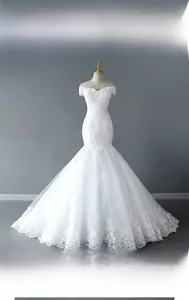 Close-up of elegant V-neck bridal gown with floral embroidery and tiered mesh hem