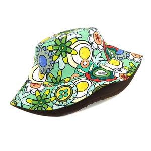 Detailed view of twill cotton bucket hat featuring vibrant pop-art floral print patterns