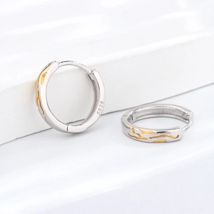 Vintage S925 sterling silver hoop earrings with gold twig detail and minimalist design