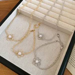 Elegant hollow flower pearl necklace and bracelet jewelry set in gold and silver finish