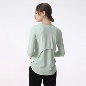 Women's mint green yoga top with breathable mesh back and stylish layered design