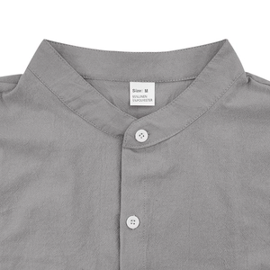 Detail of grey linen shirt neckline featuring a stand collar and high-quality stitching