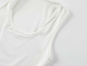 Close-up of the square neckline and stitching on a white high-elastic cropped tank top
