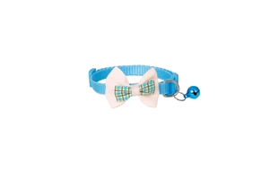 Detail of blue plaid bow pet collar with metal bell and adjustable buckle on white background