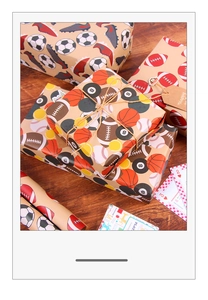 Detail of vintage kraft wrapping paper featuring football, basketball and sports patterns