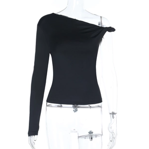 Detail of black one-shoulder slim fit top featuring unique front knot and long sleeve
