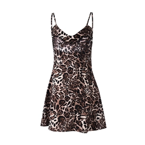 Close-up of leopard print mini dress featuring a deep V-neck and delicate spaghetti straps