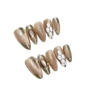 Luxurious Medusa cat eye press-on nails with champagne gold foil and almond shape