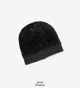 Detailed close-up of thick plush faux fur lining inside the winter knitted beanie cap