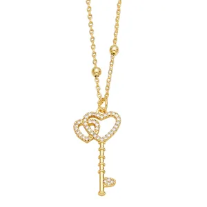 Minimalist gold heart-shaped key pendant necklace with zircon stones and bead chain