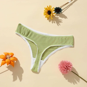 Detail of light green ribbed thong with white lace trim and dry flower decoration