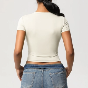 Back view of a slim-fit beige yoga t-shirt made of high-elastic knit performance fabric