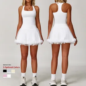 Women's white athletic yoga dress with racerback bodice and layered mesh skirt