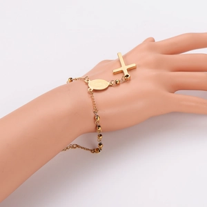 Gold stainless steel rosary bracelet with cross and Virgin Mary medal on hand model