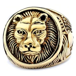 Mens gold lion head statement ring with detailed high relief embossing on white background