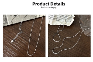 Close-up of S925 sterling silver Italian snake chain with adjustable extender and teardrop charm