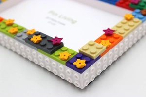 Detail view of colorful DIY building block photo frame corners for 4x6 inch pictures
