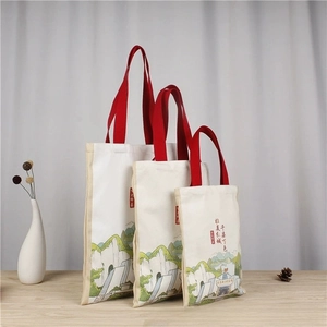 Three sizes of Van Gogh art canvas tote bags with red handles and landscape prints