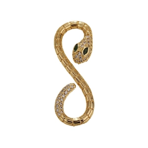Gold-plated snake pendant with green gemstone eyes and clear zircon accents on white base