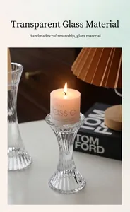 Detail of ribbed glass candle holder with scalloped petal edge in a cozy home setting