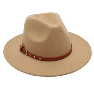 Detail of camel wool fedora hat featuring a brown faux leather belt strap and gold buckle