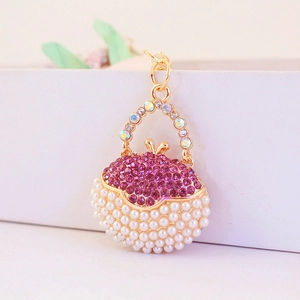 Pink rhinestone and white pearl mini handbag keychain with golden metal finish and ring clasp