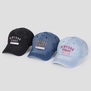 Washed denim baseball caps with New York embroidery in grey, blue, and light blue hues