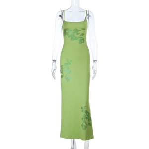 Macro detail of grass green sequin patterns on this slim fit summer maxi dress