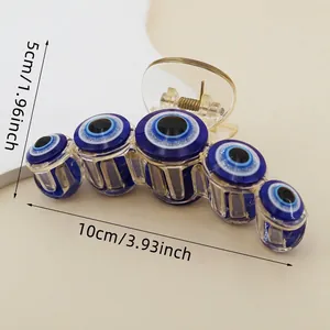 Detail view of large Evil Eye hair claw clip with size dimensions 10cm and weight specs