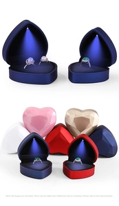 Macro shot of heart-shaped LED jewelry boxes in various colors with spotlight effect
