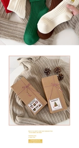 Macro detail of Christmas cotton socks with ribbed texture in a festive gift box