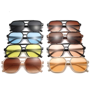 Eight pairs of oversized double-bridge aviator sunglasses in multiple vibrant colors