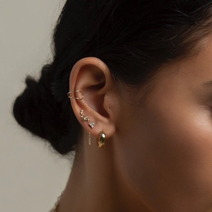 S925 sterling silver gold star stud earrings and ear cuff set worn by model