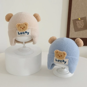 Toddler knitted winter hat with plush bear ears and Lucky label in beige and blue colors