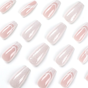 French tip coffin press-on nails with nude pink base, white edges, and glitter accents