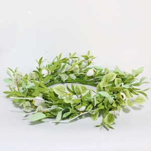 Artificial green leaf wreath with white pom-poms and yellow accents for home wall decor