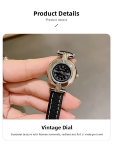 Close-up of vintage round women's watch with Roman numerals and black leather strap
