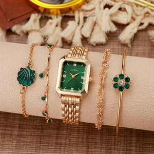 Women's gold square watch with emerald green dial and matching floral bracelet jewelry set