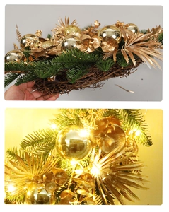 Detail of Christmas wreath with golden balls and green pine needles on woven rattan base