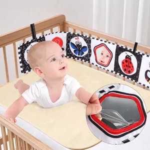 Black and white high contrast baby cloth book with safety mirror and hanging ties