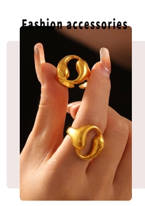 Close-up of 18k gold plated stainless steel open rings with hollow water drop design