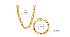 Macro detail of gold chunky curb chain set with 45cm necklace and 19cm bracelet dimensions