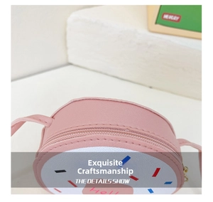 Detail shot of pink donut-shaped kids bag with smooth zipper and PU leather stitching