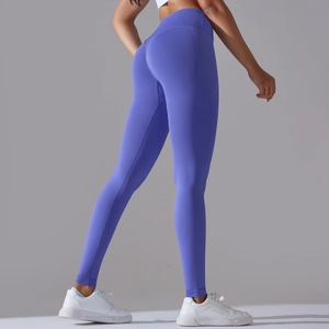 Close-up of periwinkle seamless yoga leggings featuring a crossover waist and knit texture