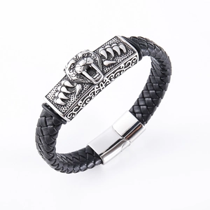 Men's braided leather bracelet with silver stainless steel lion head charm, 45-degree view